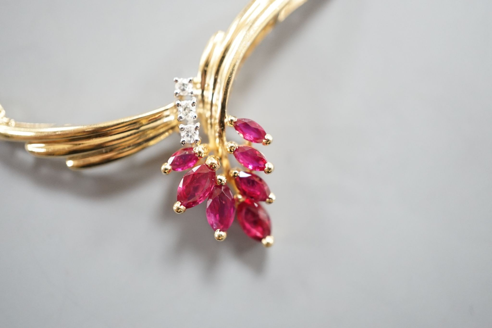 A modern 585 yellow metal, ruby and diamond cluster set pendant necklace, 44cm